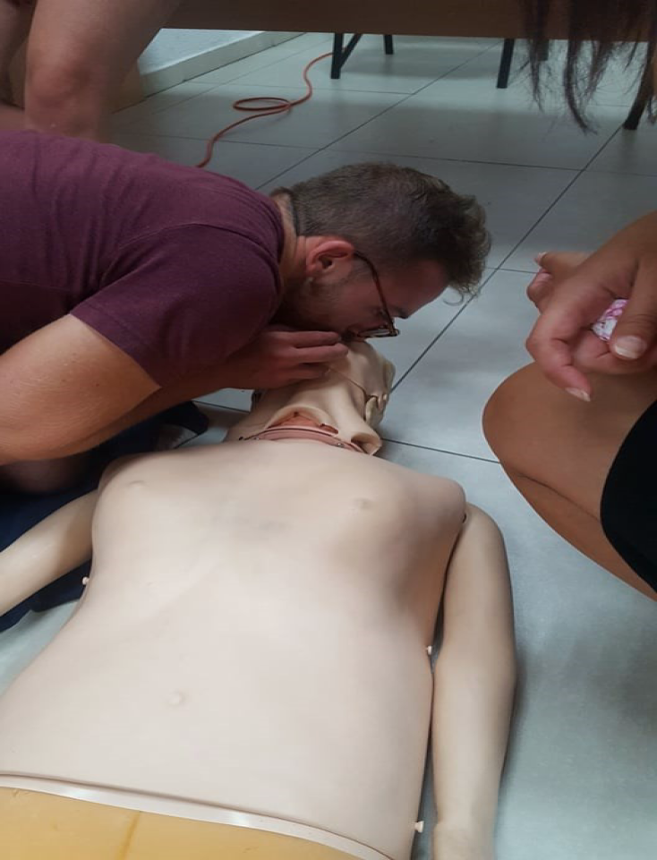 Rescue breathing practice on a training manikin