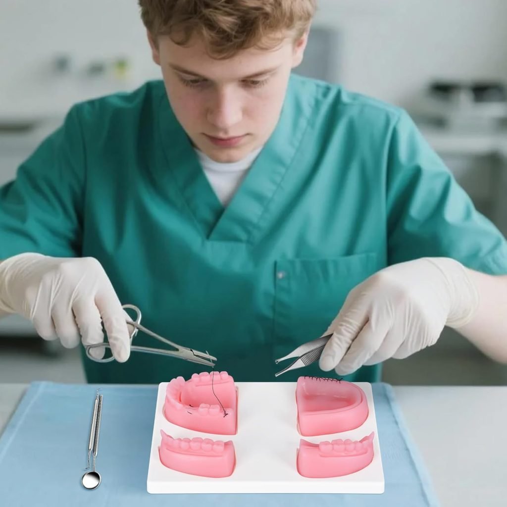 A student practicing suturing techniques on dental models