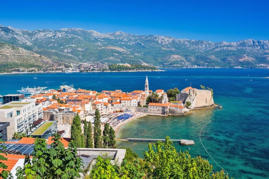 Coastal old town with stone walls and orange rooftops