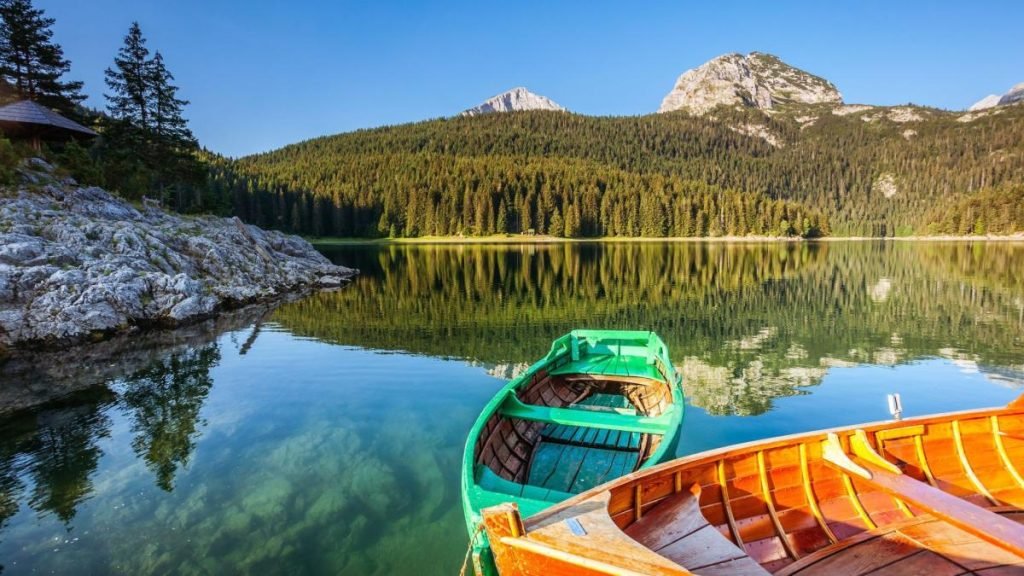 Colorful boats beside a mountain lake